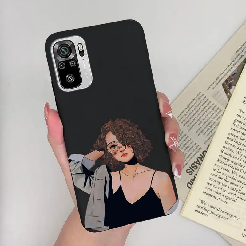 a woman in a black dress holding a phone case