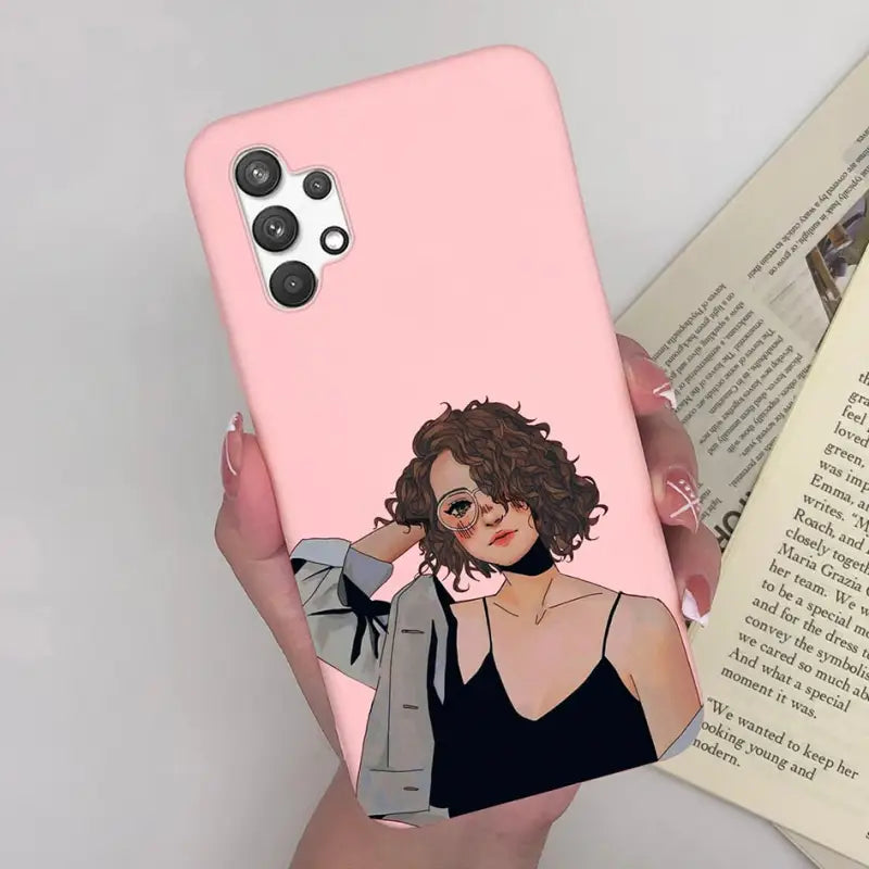 a woman in a black dress holding a pink phone case