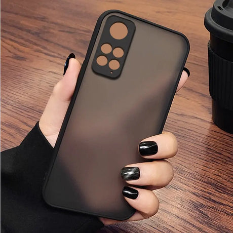 A woman holding a black iphone case