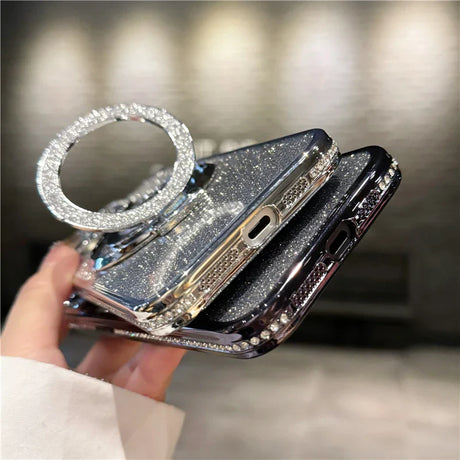 a woman holding a black phone case with a diamond ring