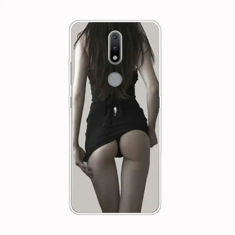 a girl in black shorts is standing on the phone case