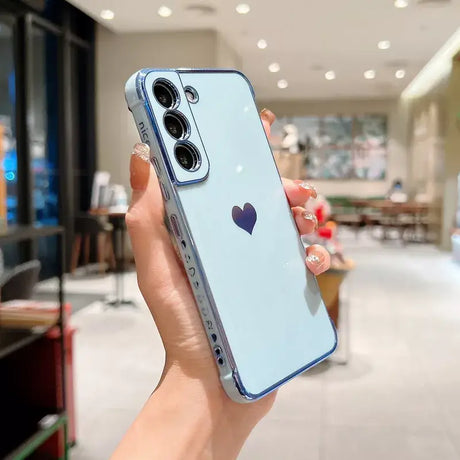 a woman holding a blue iphone case