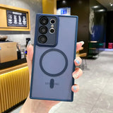 a woman holding up a blue iphone case