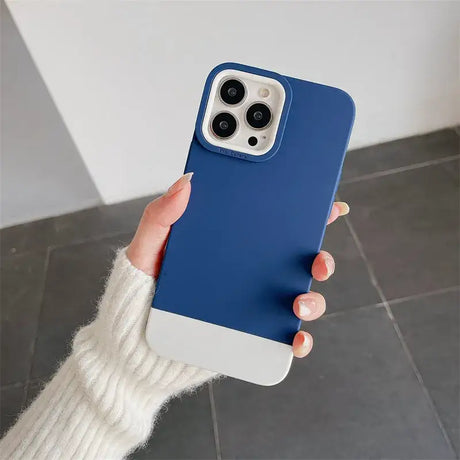 A woman holding a blue iphone case