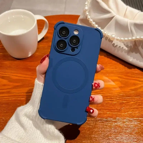 a woman holding a blue phone case