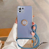 a woman holding a blue phone case with a phone holder