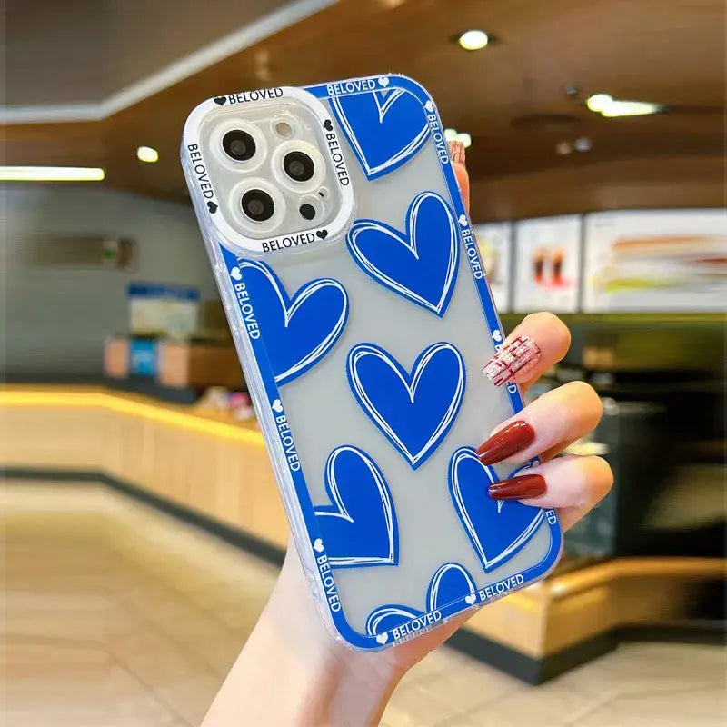 a woman holding a blue and white phone case