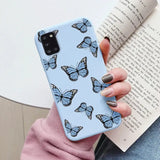 a woman holding a book and a blue butterfly phone case