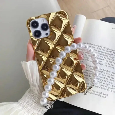 A woman holding a book with pearls and pearls on it