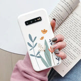 a woman holding a book and a phone case