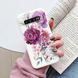 a woman holding a book and a phone case
