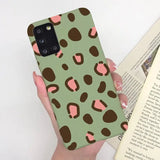 a woman holding a book and a phone case