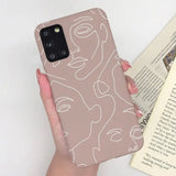 a woman holding a book and a phone case