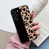 a woman holding a book and a phone case