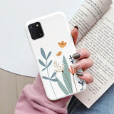 a woman holding a book and a phone case