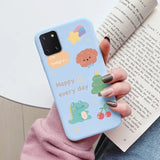 a woman holding a book and holding a phone case