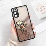 a woman holding a bouquet phone case