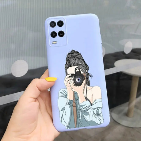 a woman holding a phone case with a cartoon drawing on it