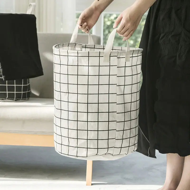 a woman holding a white and black bag