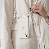 a woman holding a cell phone case