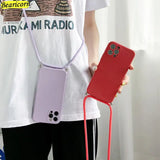 a woman holding a cell phone case