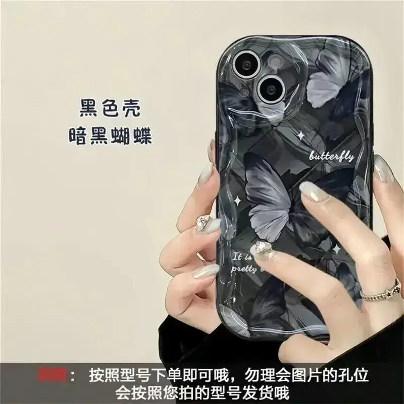 a woman holding a cell phone case with a black and white marble pattern