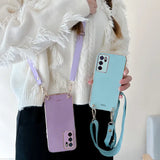 a woman holding a cell phone case