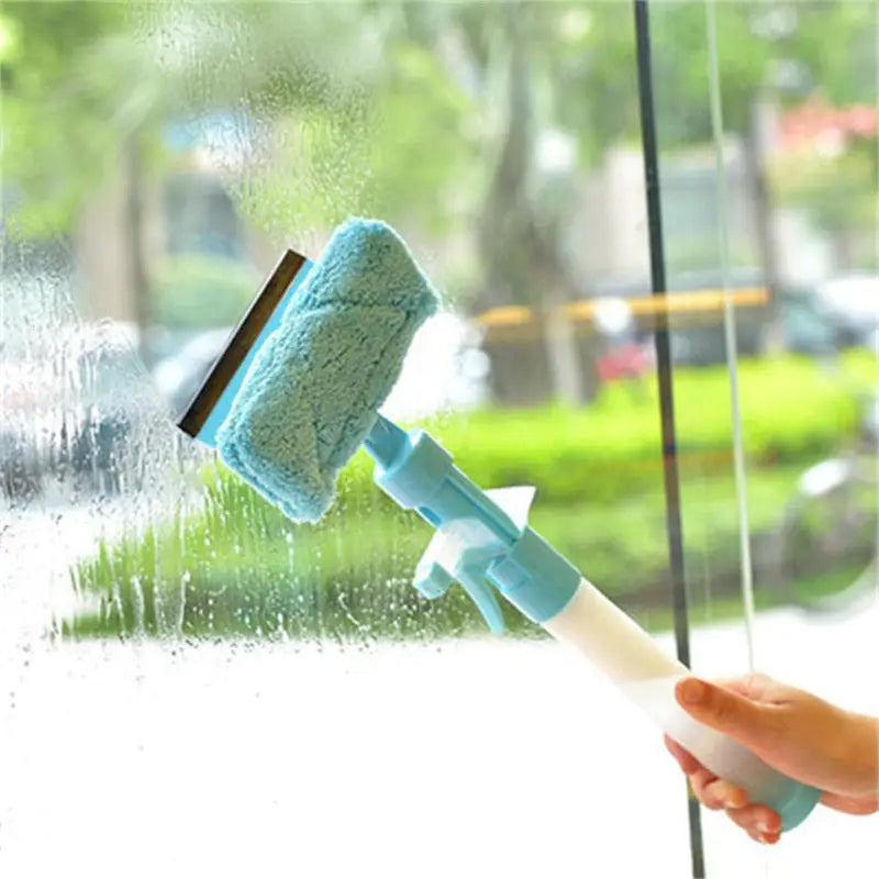 a person cleaning a window with a brush