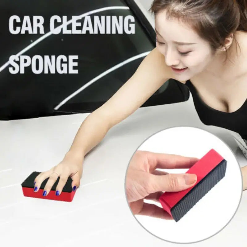 a woman cleaning a table with a sponge