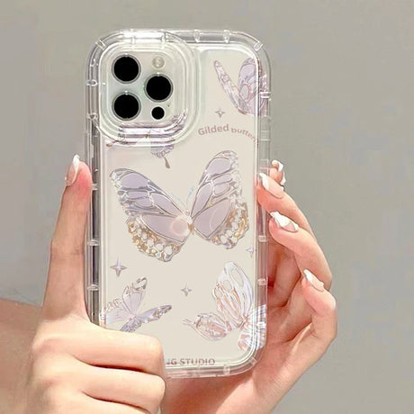 a woman holding a clear case with butterflies on it