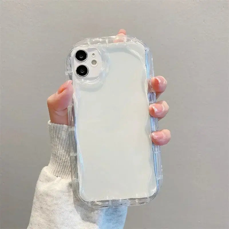 a woman holding a clear case for the iphone