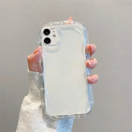 A woman holding a clear case for the iphone