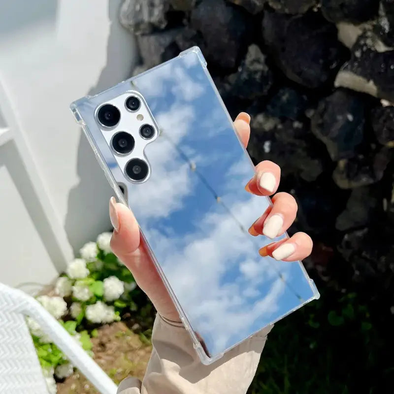 a woman holding up a clear case for the iphone 11