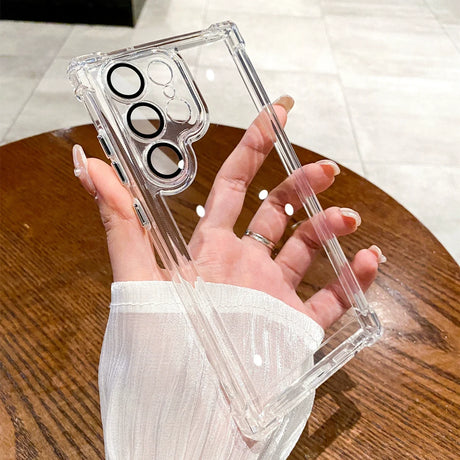 a woman holding a clear case with a ring on it