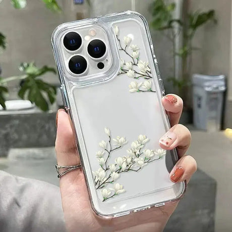 A woman holding a clear case with white flowers on it