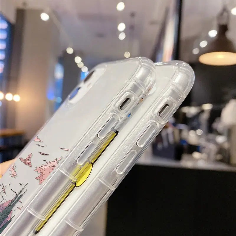 a woman holding a clear case with a yellow handle