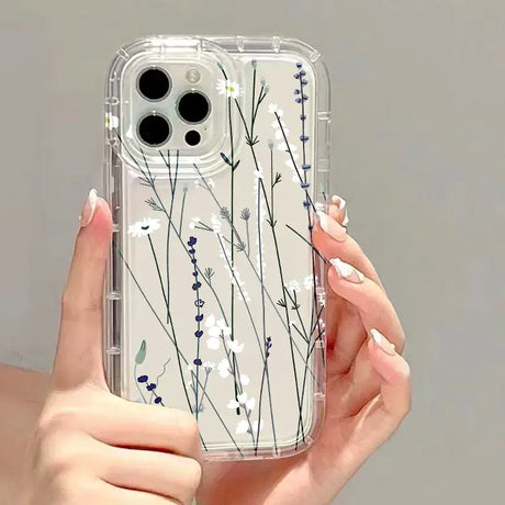 A woman holding a clear phone case with blue flowers