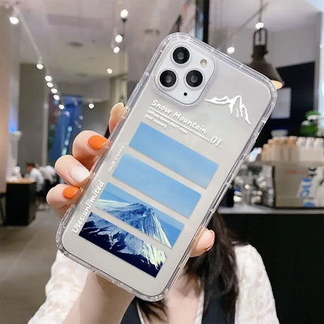 A woman holding up a clear phone case