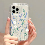 a woman holding a clear phone case with blue flowers