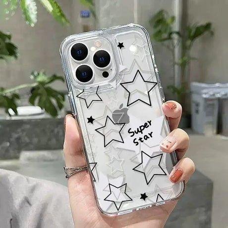 A woman holding a clear phone case with stars on it