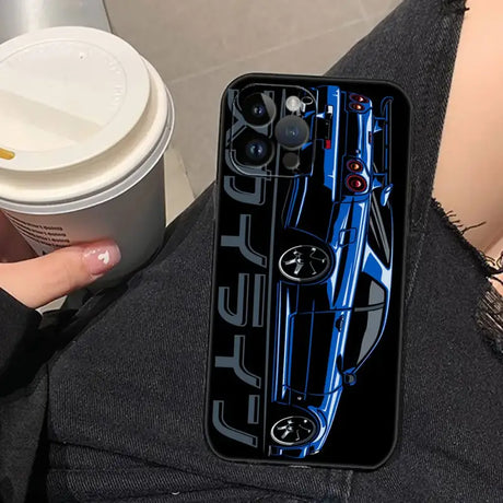 A woman holding a cup and a phone case