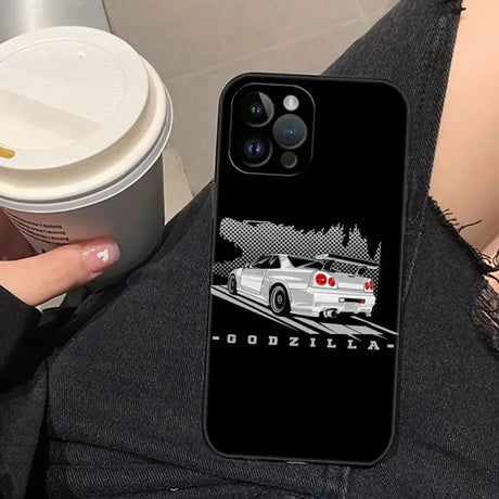 A woman holding a cup and a phone case