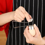 a woman is peeling an egg with a pair of scissors