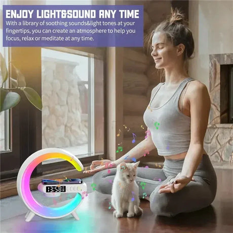 A woman sitting on the floor with a cat and a colorful light