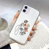 a woman holding a flower phone case