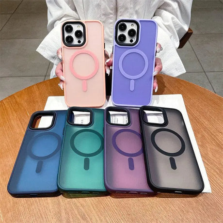 A woman holding four iphone cases with a phone in the middle