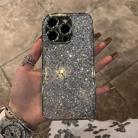 A woman holding a glitter phone case