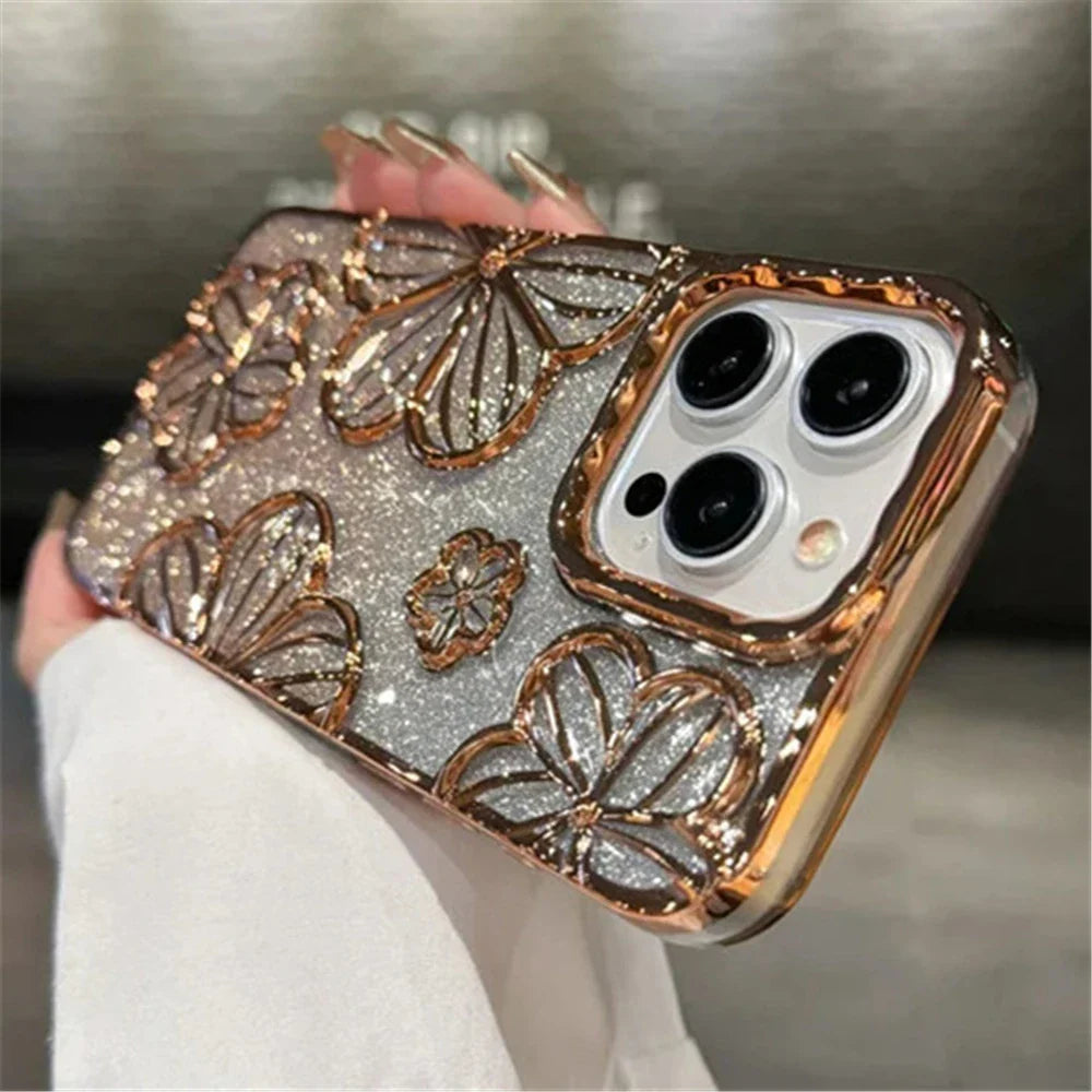 a woman holding a gold iphone case with a white background