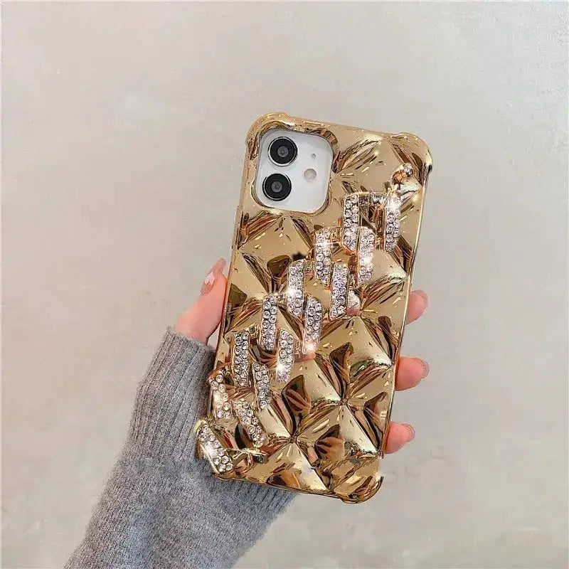 a woman holding a gold phone case with a bunch of flowers