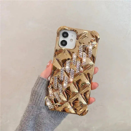 A woman holding a gold phone case with a bunch of flowers